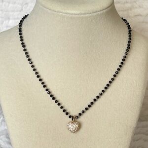 Rhinestone heart on black bead necklace, gold tone